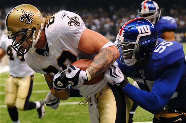 The Saints' Jeremy Shockey, left, beats New York Giants linebacker Danny Clark for a touchdown receptio